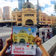 Xavier at Flinders St with book